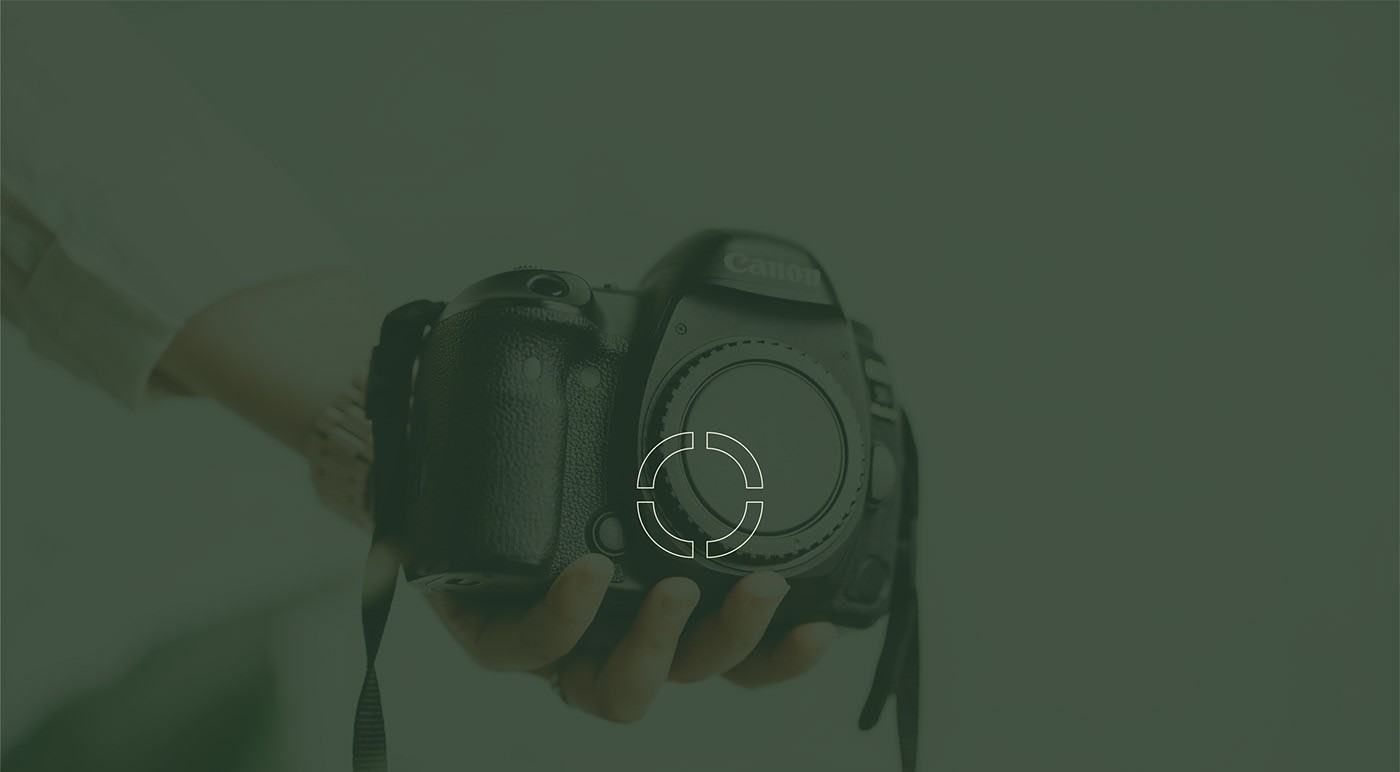 Photographer holding a professional camera